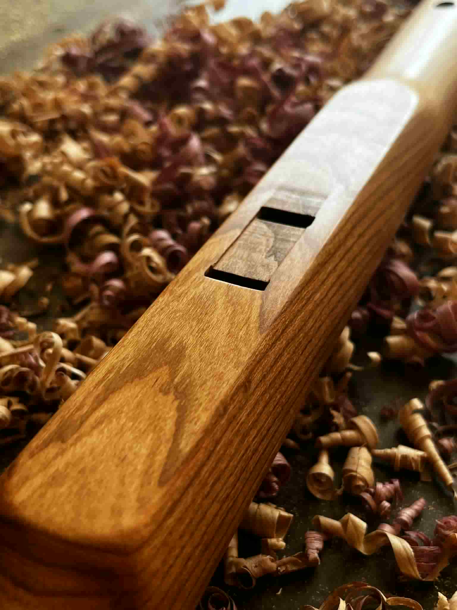 River Song — close-up of the voicing window, two hand-cut rectangular sound holes in the warm cedar top